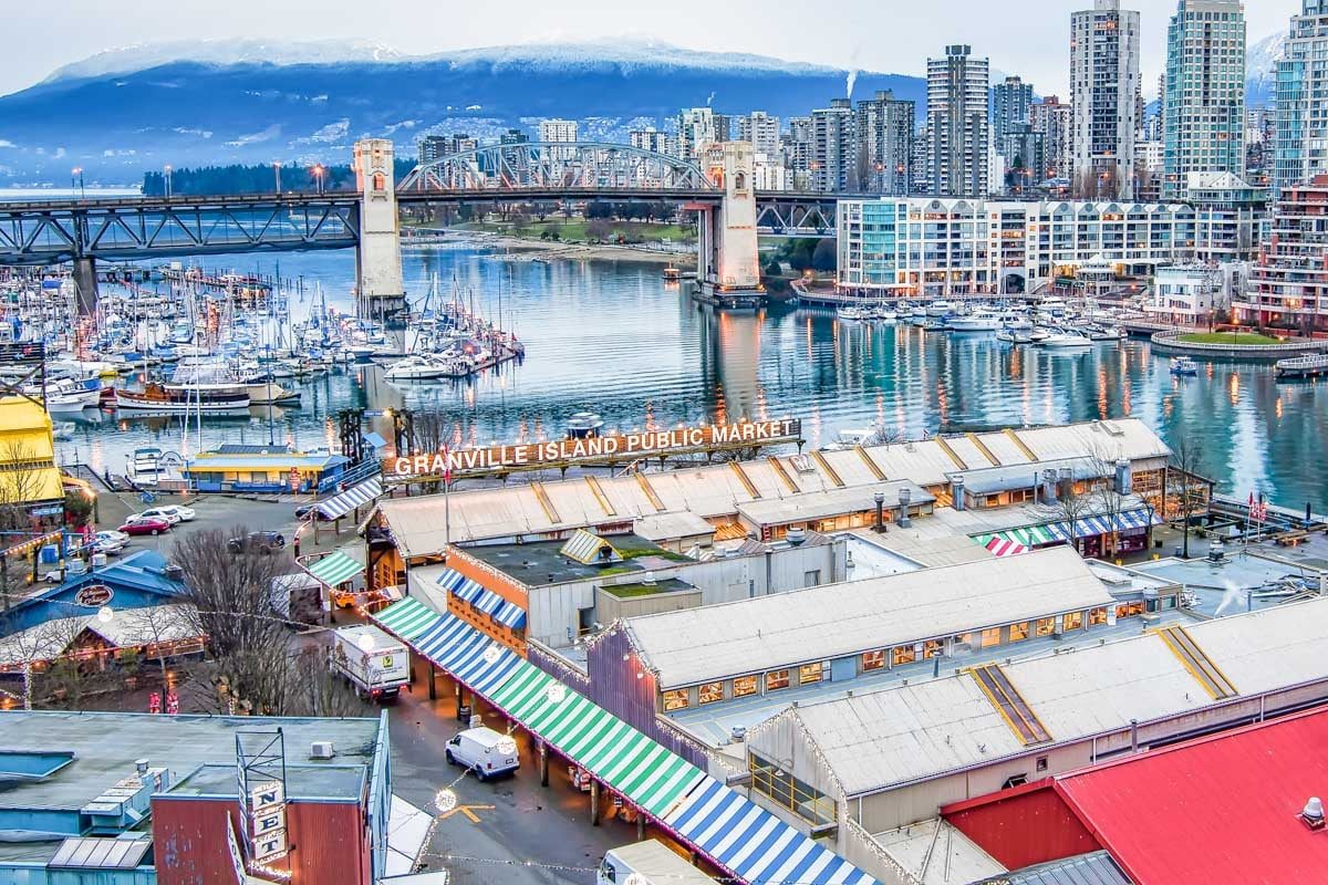 Birds-eye-view-of-Granville-Island-with-the-cityscape-in-the-background