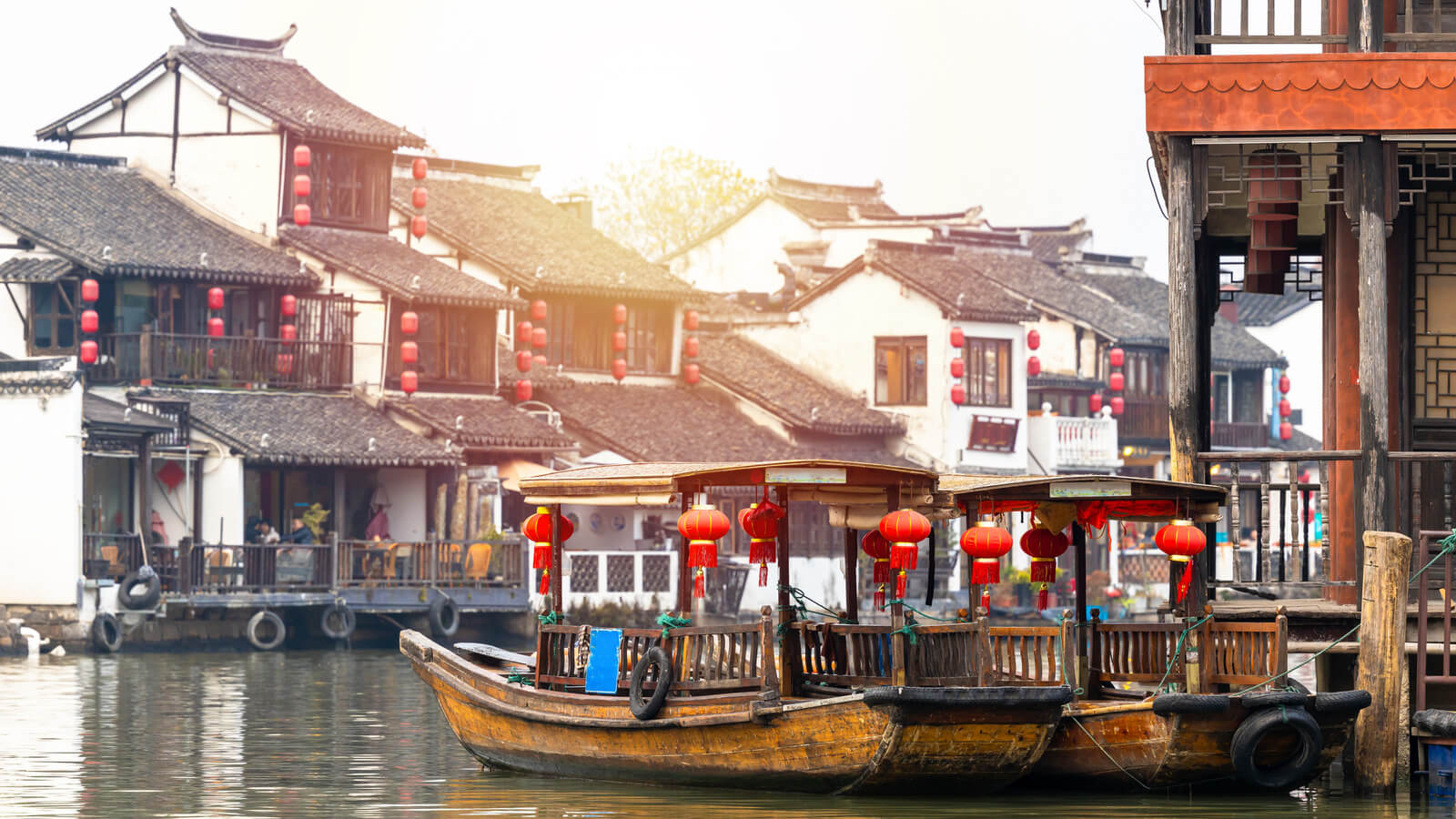 Zhujiajiao Water Town and China traditional tourist boats on canals of Shanghai Zhujiajiao Water Town in Shanghai, China.