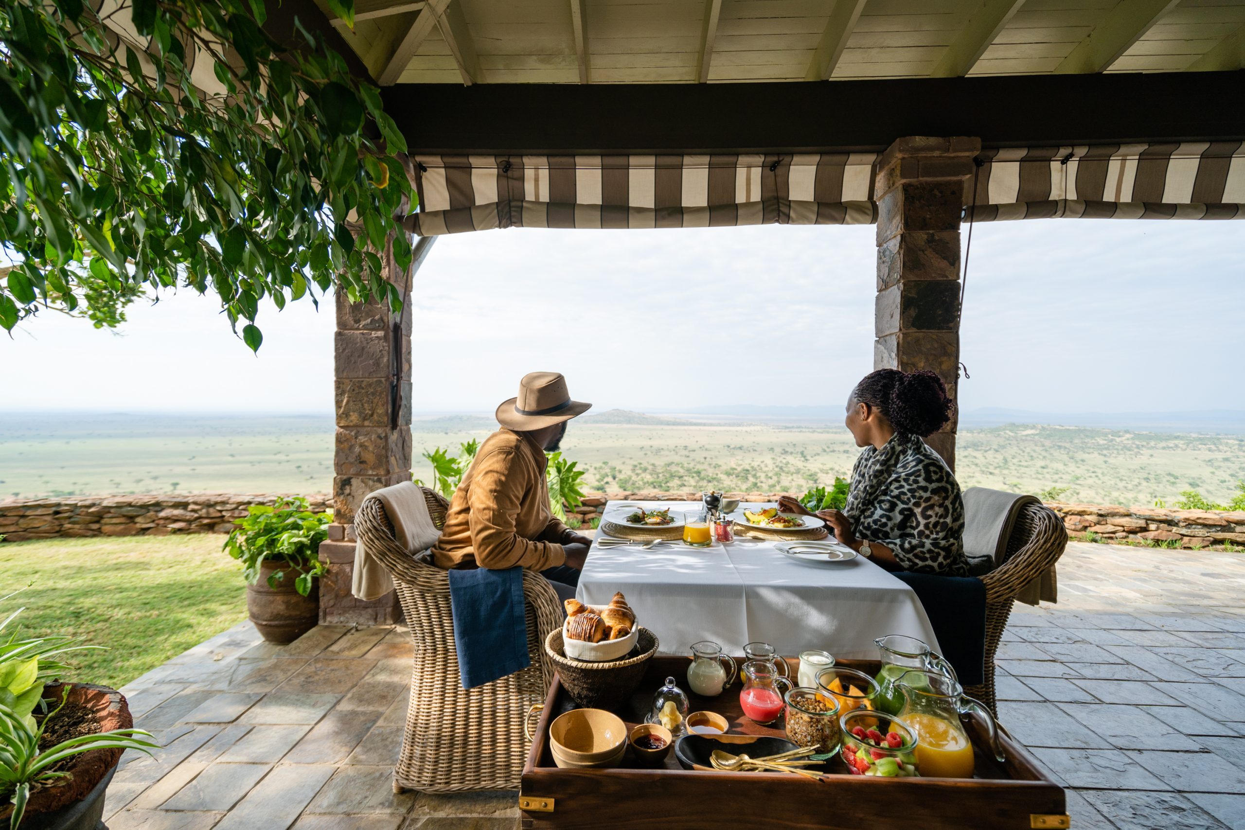 Singita Sasakwa Lodge_Couple Dining on Verandah_Osse Sinare