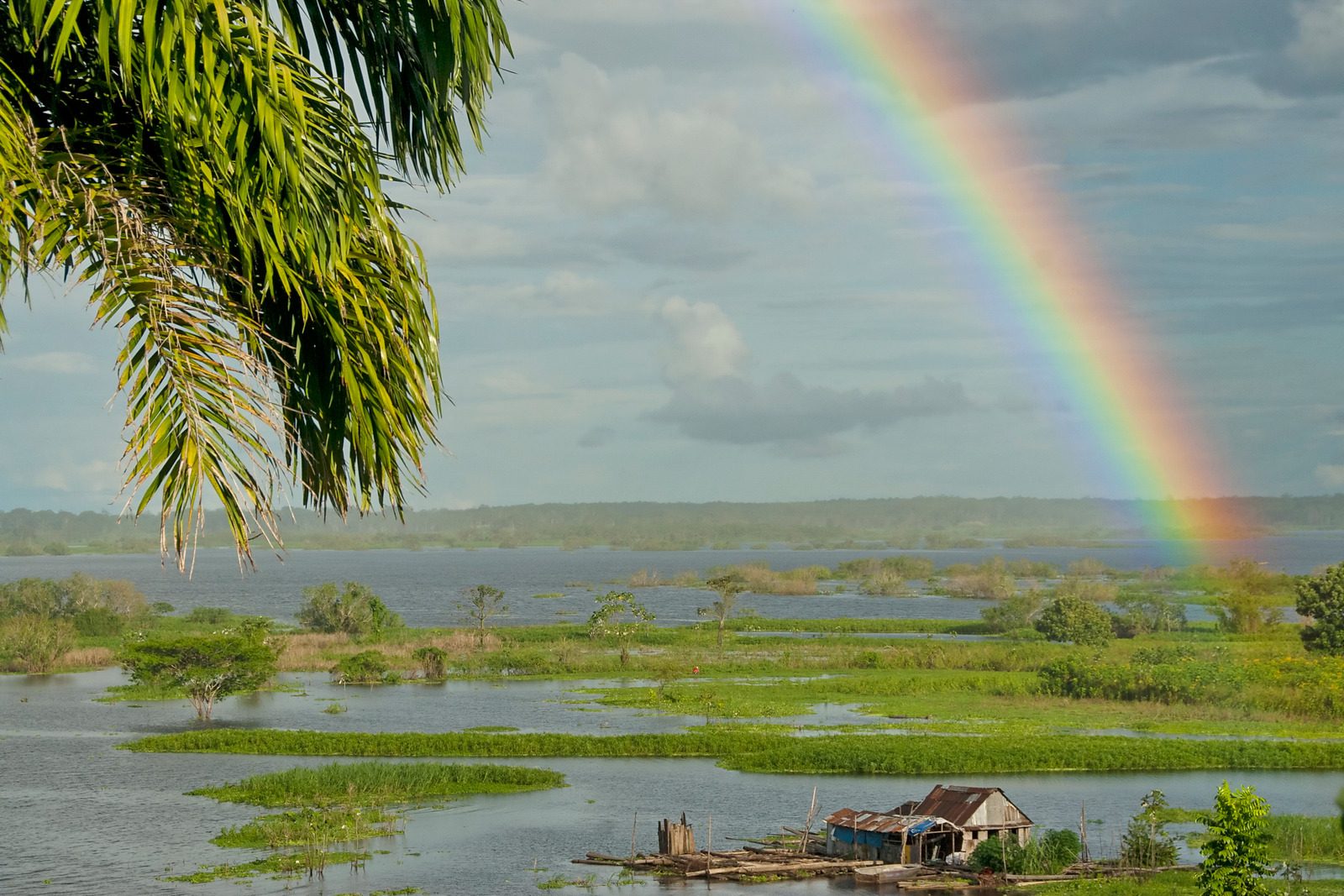 Rainbow over Amazon river near Iquitos, Peru.